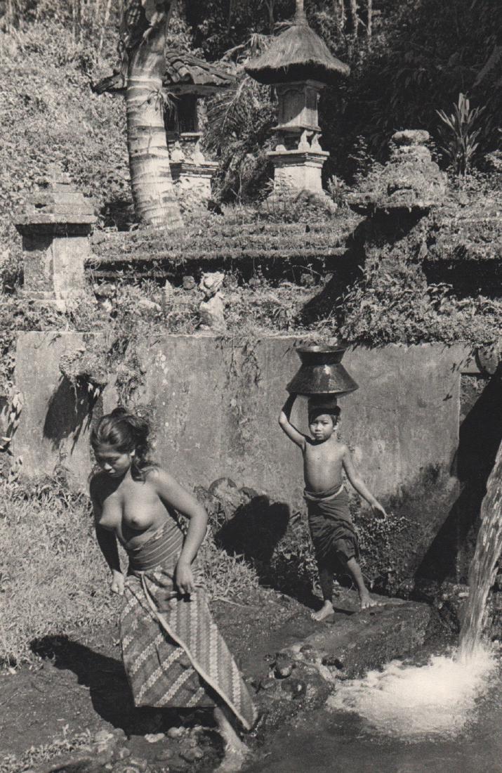HENRI CARTIER-BRESSON - Bali, Indonesia 1950: Artist: HENRI CARTIER-BRESSON Print Title: Bali, Indonesia 1950, Child carrying cooking water Medium: Sheet-fed Gravure Printing Date: 1952 Printed: France Image Size: 9 X 13.5 inches Henri Cartier-Br