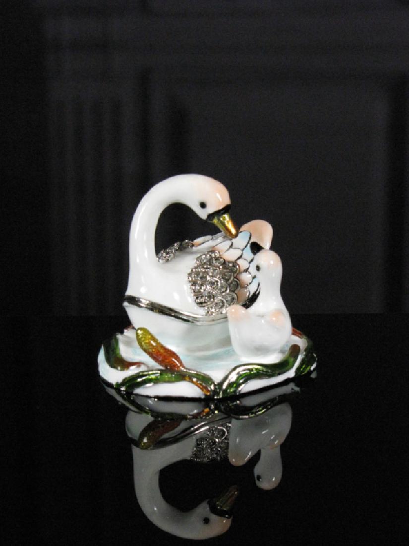 Fabergé Style TrinketBox Swans: Maker: Keren Kopal Origin: Israel Date/Period: 2017 Materials: Tin alloy base plated with gold and Strass Crystals Size: H 1.96 x W 2.10 inch Description: Fabergé Style Jewelery Box - Swans by artist