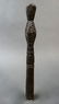 This dark paddle handle has design/ clan motifs on the