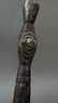 This dark paddle handle has design/ clan motifs on the - 4