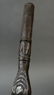 This dark paddle handle has design/ clan motifs on the - 5