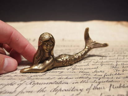 5"Brass Nautical Mermaid Paperweight Desk Figure: 5" long x 1 3/4" tall 1" Wide Very accurate and well made reproduction of an antique paperweight. All solid brass, darkened to look old. Certainly easy to wonder its age Great for use or display in an