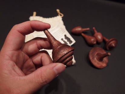 6Spinning Tops Toy w Cloth Bag: 6 different reproduction antique wood spinning tops as shown. They are about 2 1/2" high No Reserve: This lot starts at $1 and has no reserve as a courtesy so that collectors can determine the true