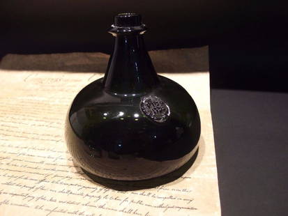 8"Colonial Black Glass Blown Onion Bottle (Green): 8" x 8" Great reproduction onion bottle with a polished pontil. See the images the bottom has some scratches and scuffs, no cracks or chips.. Please note that this lot has a confidential reserve.