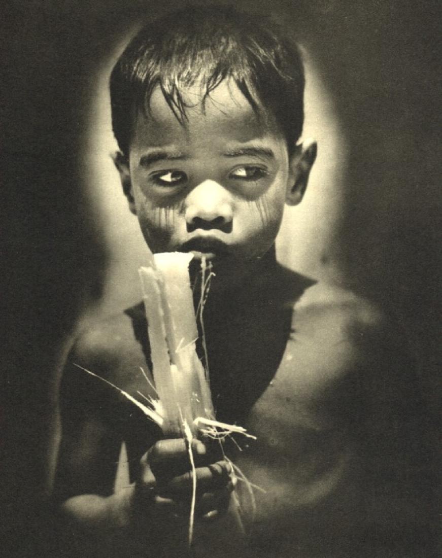 M. ARTHUR ROBINSON - Boy eating Sugar Cane: Artist: M. ARTHUR ROBINSON Print Title: Boy eating Sugar Cane Medium: Sheet-fed Gravure Printing Date: 1940 Printed: Great Britain Image Size: 6.5 X 8 inches No Reserve: This lot starts at $1 and has 