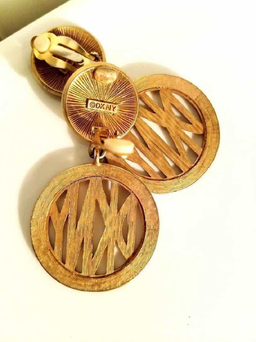 Vintage DKNY Gold Plated Signature Earrings: Vintage DKNY gold plated Signature Earrings. DKNY Signature gold plated earrings absolutely stunning in amazing showroom condition. Signed on the back Please note that this lot has a confidential rese