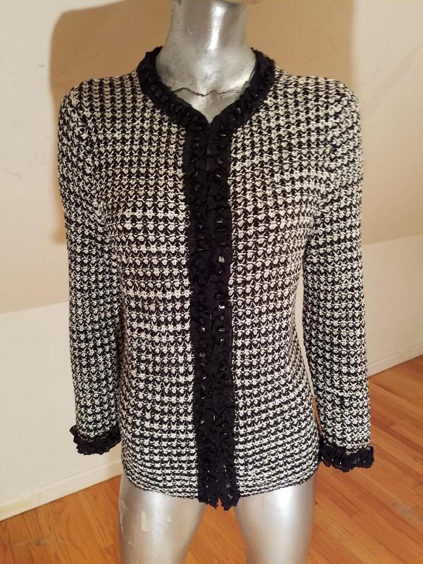 Vintage Knitted Tunic Sweater Onyx Embellished: Vintage knitted tunic sweater onyx Embellished. This one is truly a beauty long knotted black and white tunic sweater Embellished with onyx beads Size-M Please note that this lot has a confidential re