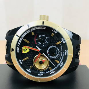 Scuderia Ferrari – Red Rev T Chronograph Sports Watch: • Gold-tone and Black steel & ABS polymer case.• Silicone strap.• Black dial.• Quartz movement.• Date.• Water resistant 30 meters.Case diameter: