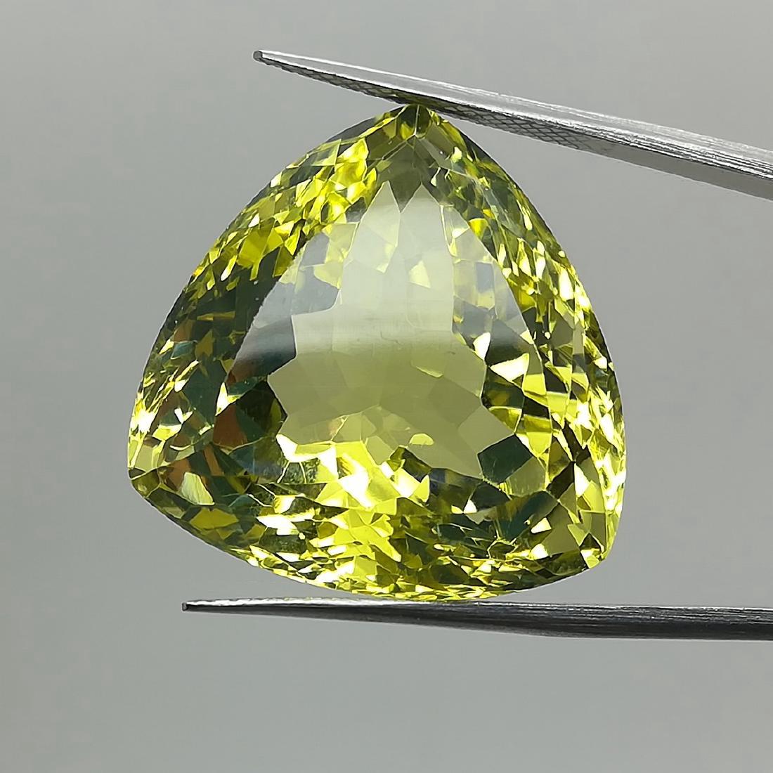 36.80 Carat Loose Lemon Quartz Trillion Cut: Item: LEMON QUARTZ TRILLION CUT Loose Gemstone: LEMOS QUARTZ Carat Weight: 36.8 Size/Dimensions: 20.94X21.38X14.96 MM IRRADIATED Please note that this lot has a confidential reserve. When you leave a 