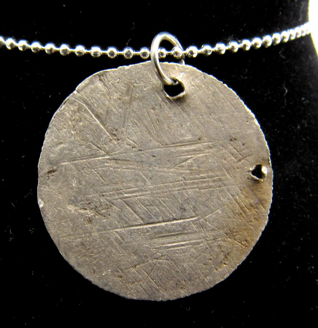 Medieval Viking Silver Hammered Coin Pendant: Date: Circa 9th – 11th c. AD Material: silver Provenance: Obtained from an old British collection, purchased from a gentleman in Birmingham Dimensions: 22mm; 2.4grams Medieval Viking Silver Hammered