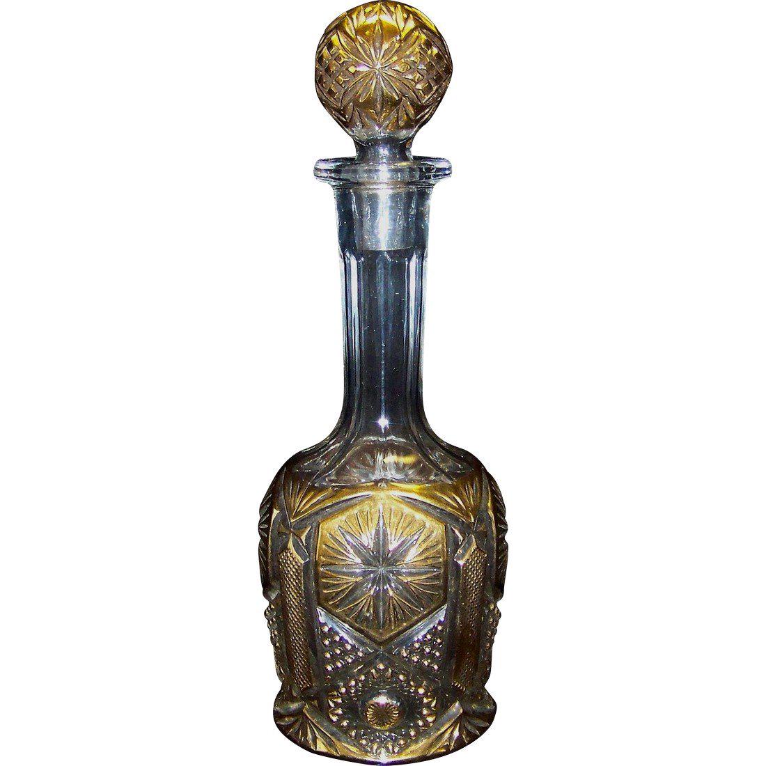 Antique US Glass Company Bullseye & Daisy Decanter: Antique Bullseye & Daisy Decanter produced by the U S Glass Company in 1909 and the pattern was first introduced as Newport. This antique decanter features a dominant daisy pattern with a subdued bull
