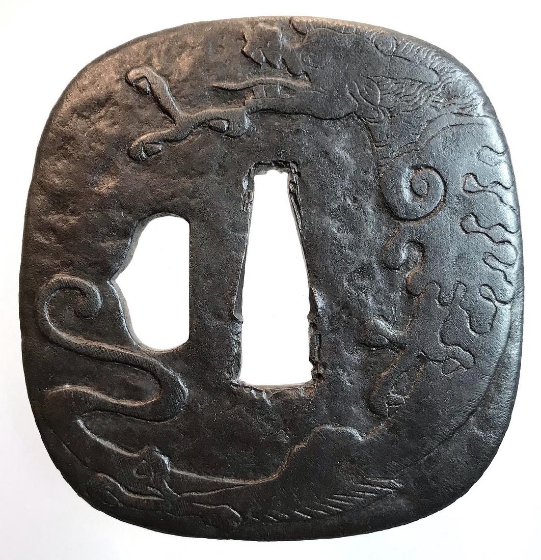 Iron tsuba by Higo Jingo school, with a dragon and a (1 of 2)