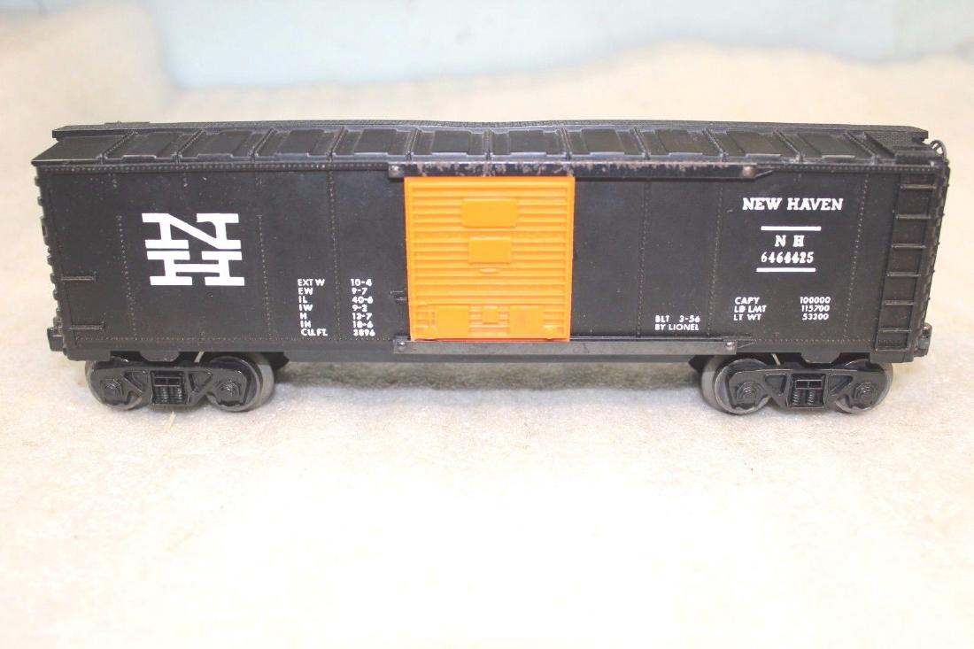 Lionel Postwar 6464-425 NH New Haven Black Boxcar: Lionel Postwar 6464-425 NH New Haven Black Boxcar. Car is nice, but has some marks on the door guides. Has AAR trucks. See photos for the exact condition. It is graded on its appearance only. It is no