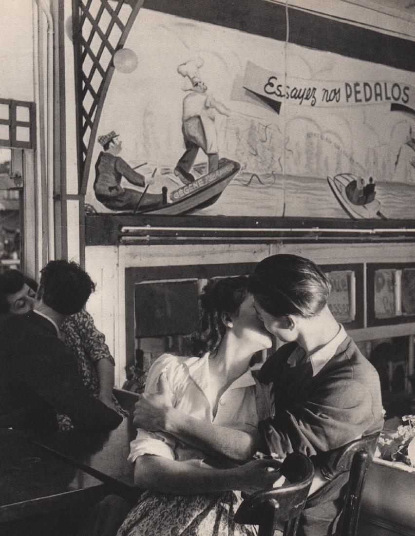 ROBERT DOISNEAU - Amour at Chez Gegene: Artist: ROBERT DOISNEAU Print Title: Amour at Chez Gegene Medium: Sheet-fed Gravure Printing Date: 1949 Printing Location: Switzerland Image Size: 6.5 x 8.5 inches Robert Doisneau (1912-1994) was a Fr