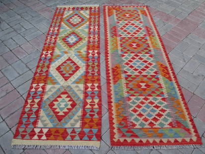 2 Hand Woven Chobi Kilim Runners Rug 6.4x2 - 6.3x1.11: Two super quality vegetable dye wool chobi kilm runners feature a double face design this kilim is also very hard wearing Afghanistan 6.4x2 - 6.3x1.11 Wool 2017 Please note that this lot has a