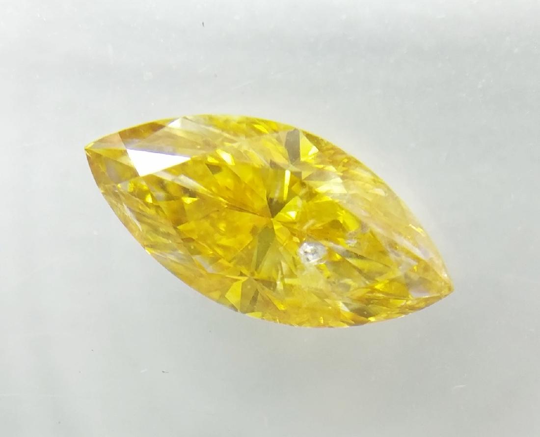 0.72 ct Marquise cut diamond Fancy Vivid Orangy Yellow: Item: 0.72 ct Marquise cut diamond Fancy Vivid Orangy Yellow SI2Shape: Marquise Color: Fancy Vivid Orangy Yellow SI2 Carat Weight: 0.72 Size/Dimensions: VG-VG-N Sealed Please note that this lot has a