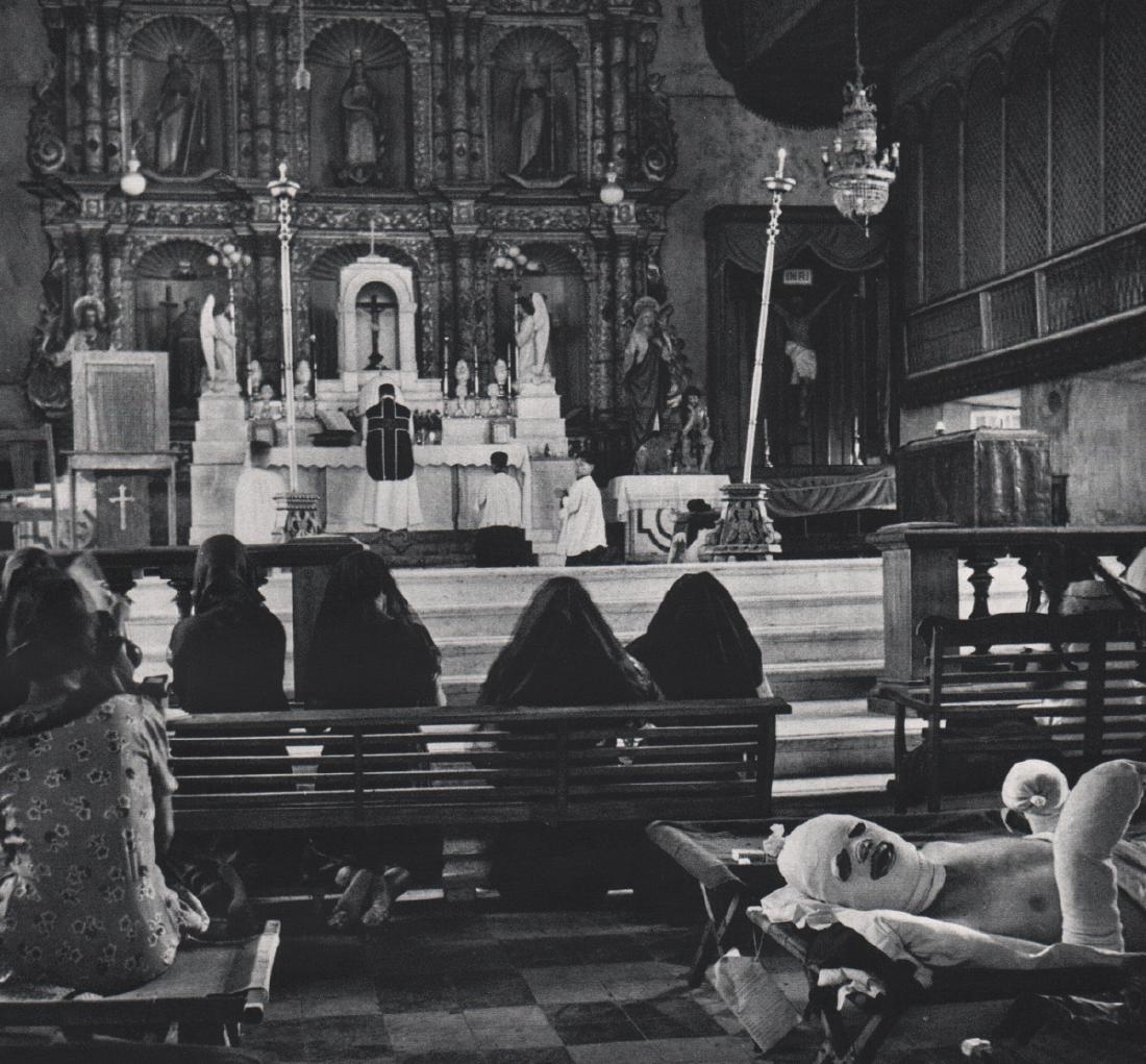 W. EUGENE SMITH - Mass, Leyte Cathedral: Artist: W. EUGENE SMITH Print Title: Mass, Leyte Cathedral, Philippines, 1944 Medium: Sheet-Fed Gravure Printed in 1969 Printed in Italy Image Size: 8.75 x 7.75 inches William Eugene Smith (1918-1978)