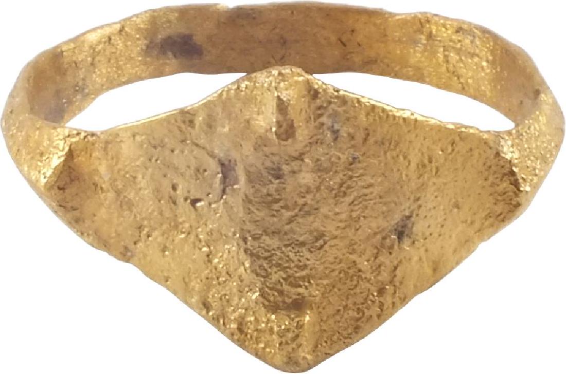 VIKING APOTROPAIC RING, 10th CENTURY AD: Gilt bronze with rounded band flared to the shoulders. Elongated diamond form bezel with a small spike to each point. Apotropaic form specifically designed to avert evil. Size 11. The gold surface ren