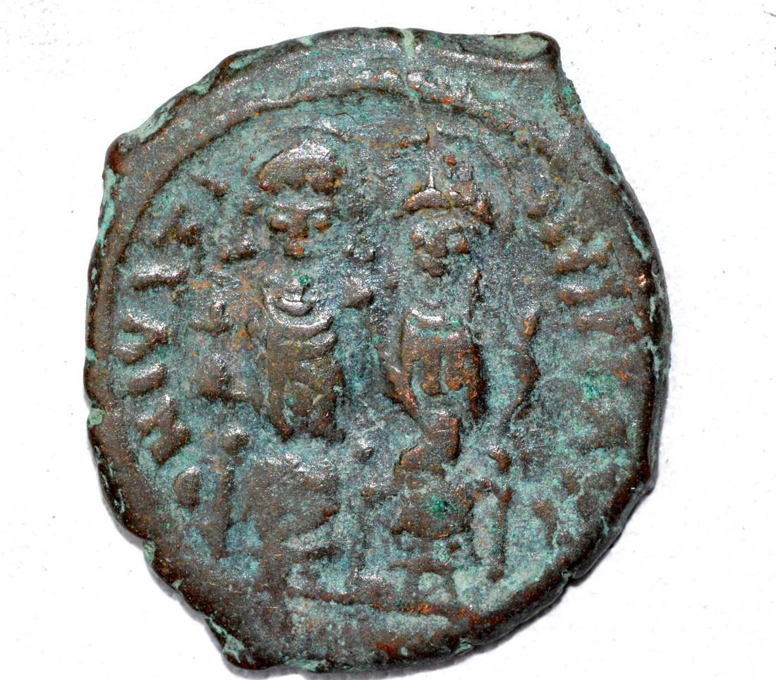 Byzantine AE24 "K" Follis Coin: Date: ca. 800 AD Material: bronze Provenance: From an old British collectom, acquired on German and Austrian art markets. Dimensions: 24mm; 6.9grams Byzantine AE24 K Follis Coin. Superb Ancient Coin i