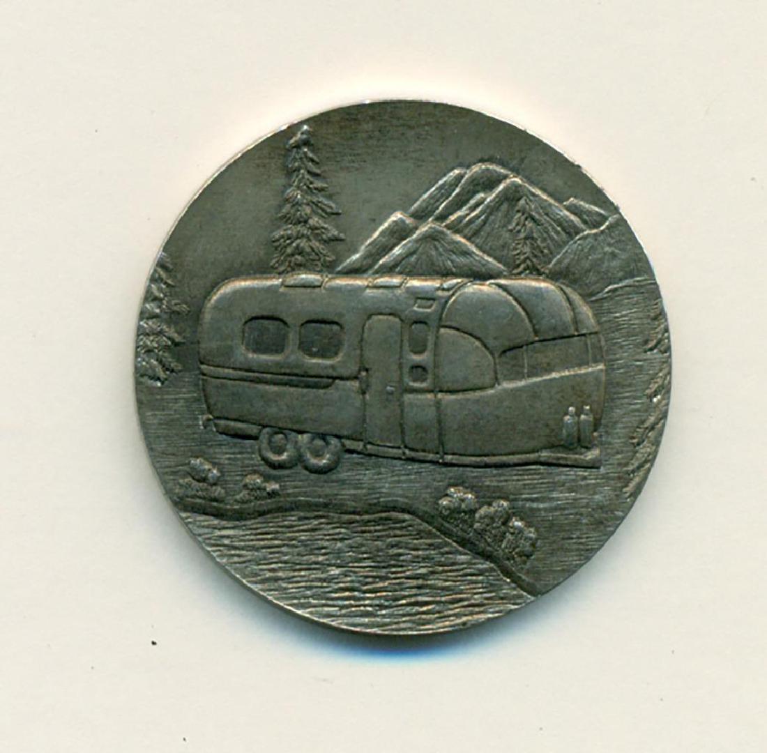 1970 WBCCI Airstream Travel Trailer Token 13th Rally: Circa 1970 metal token depicting an Airstream travel camper trailer on one side and text on the other side reading: "W.B. C.C.I. 13th INT'L RALLY, HERSHEY PENNA." Approximate diameter is 1-1/4". Brief