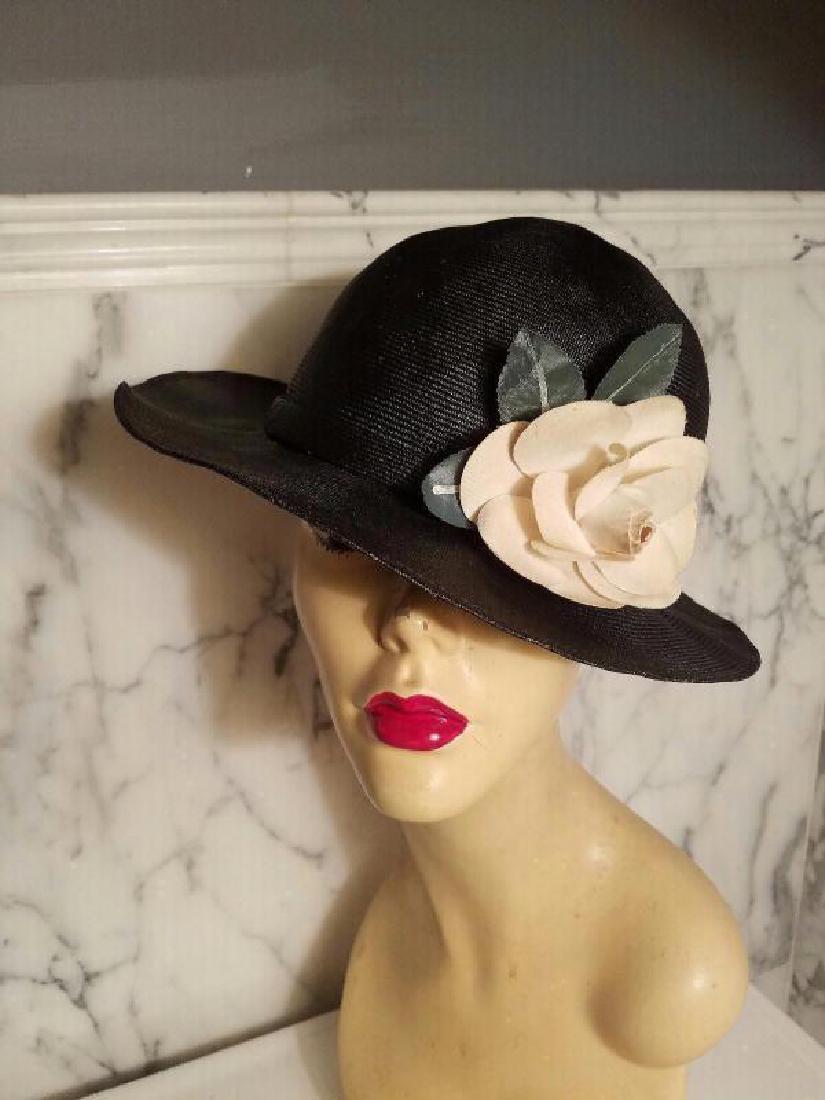 vtg Adolfo tilt brim straw hat millinery flower: vtg Adolfo tilt brim straw hat millinery flowerA very beautiful classic Adolfo straw hat with a millinery rose flower The inside has grosgrain ribbon trim all around In very good vintage condition Cir