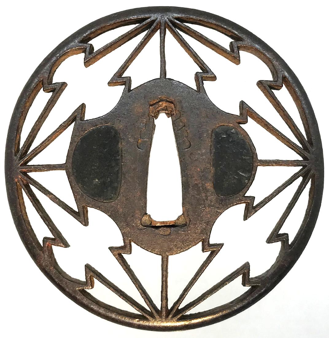 Iron sukashi tsuba with NBTHK "Hozon" attestation: Item: Iron sukashi tsuba with NBTHK "Hozon" attestation Origin: Japan Date: Edo period Materials: Iron Height: 73.5 mm; Width: 72.5 mm; Thickness: 6.2 mm; Weight: 86 g Tsuba of circular form decorated