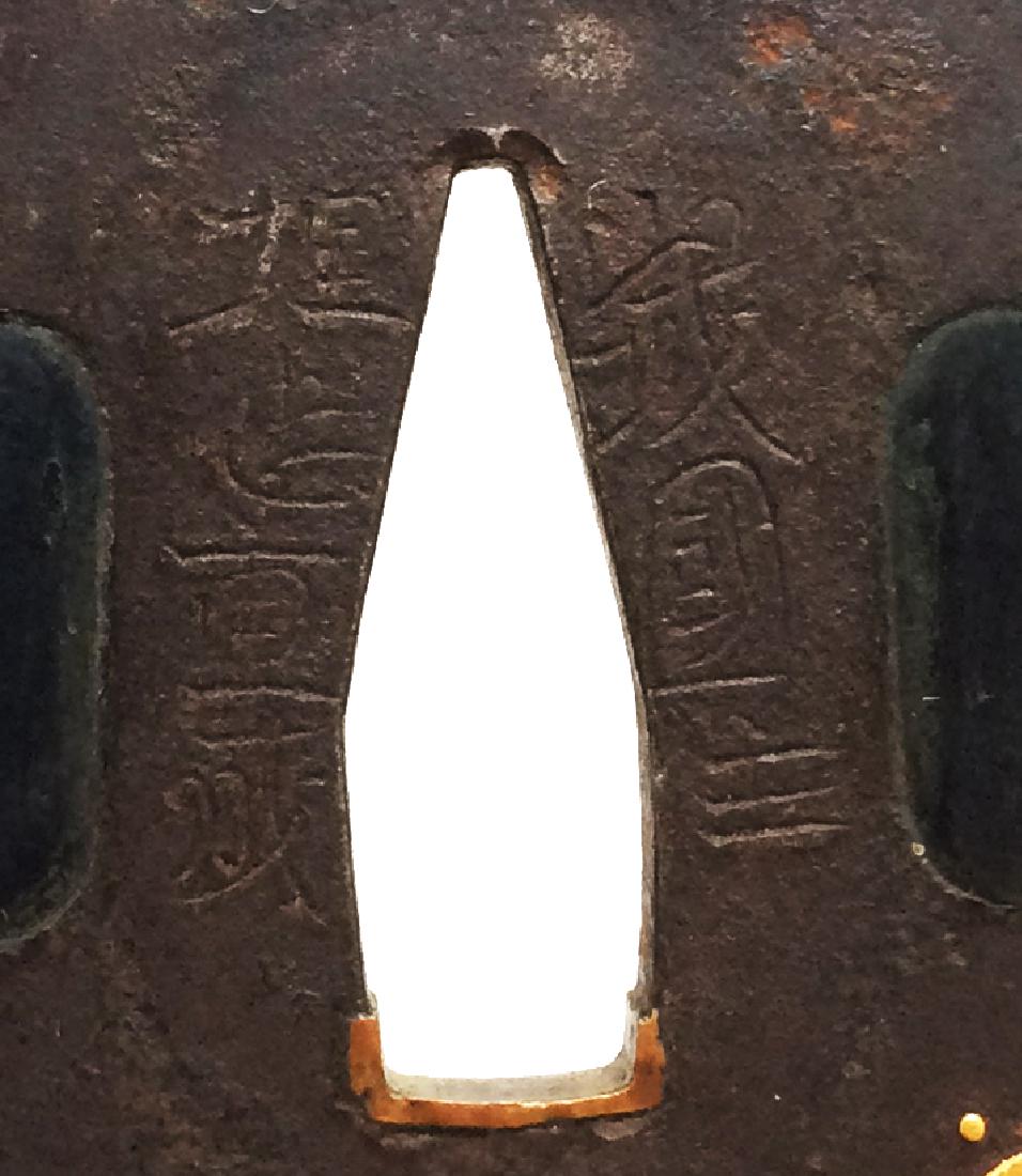 Signed iron tsuba carved and inlaid with gold byUmetada: Item: Signed iron tsuba carved and inlaid with gold byUmetada Shigenariof Yamashiro Origin: Japan Date: Edo period, 17th century Materials: Iron, gold Height: 78.8 mm; Width: 75.5 mm; Thickness: 4.4 m