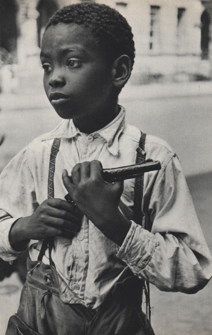 HELEN LEVITT - Armed Boy: Artist: HELEN LEVITT Print Title: Armed Boy Medium: Sheet-fed Gravure Printing Date: 1965 Printing Location: Switzerland Image Size: 4.75 x 7.5 inches Helen Levitt(1913-2009) was an American photograp