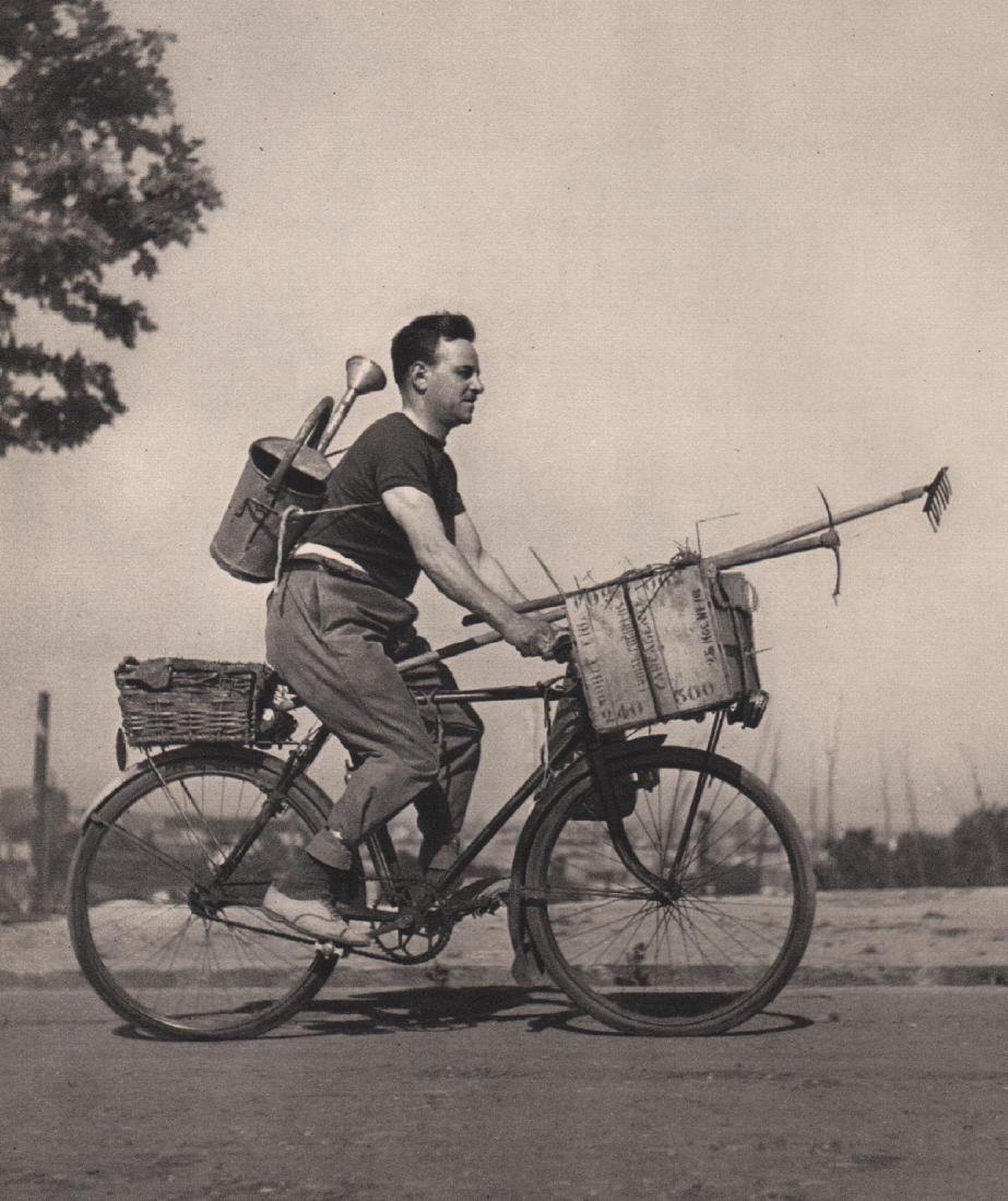ROBERT DOISNEAU - Sun King on a Bicycle: Artist: ROBERT DOISNEAU Print Title: Sun King on a Bicycle Medium: Sheet-fed Gravure Printing Date: 1949 Printed in Switzerland Image Size: 6.5 x 7.5 inches Robert Doisneau (1912-1994) was a French ph