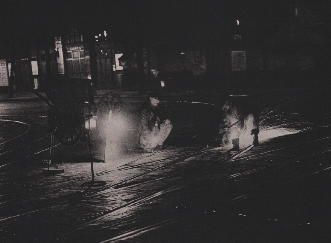 BRASSAI - Workmen polishing the Rails: Artist: BRASSAI Print Title: Workmen polishing the Rails Medium: Sheet-fed Gravure Printing Date: 1987 Printed in France Image size approx. 8.5 X 6.5 inches Brassai was a Hungarian–French photograph