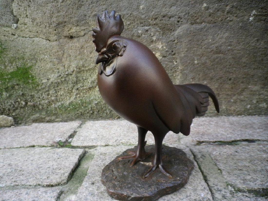 After François Pompon: Coq Dormant statue: Item: After François Pompon: Coq Dormant statue Maker: Mouseion CollectionOrigin: Netherlands Date/Period: 2017 Materials: Polystone Size: H. 7.87 x W 9.44 inch Coq Dormant statue, inspired by the sc