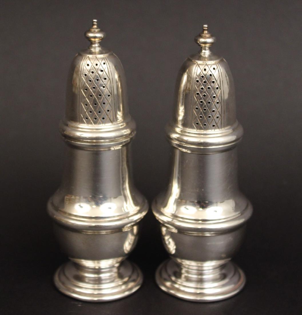 1968 Wakely & Wheeler London Silver Shakers: This pair of shakers has the hallmark of Wakely & Wheeler and the date letter for 1968. Each measures 4 3/8" tall, total weight is 120 grams. Both are in excellent condition with no damage and no mono