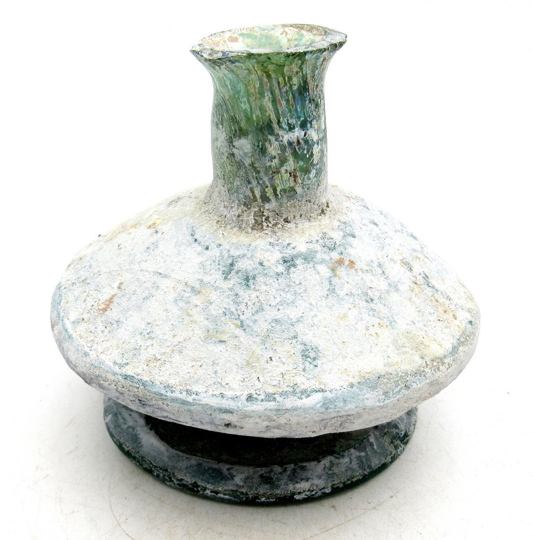 Ancient Roman/ Byzantine Glass Flask: Ancient Roman/ Byzantine Glass Flask Circa 5th – 9th c. AD Ancient Roman / Early Byzantine Glass Flask. Professionally cleaned and polished to show original details. This item includes one lifetime 