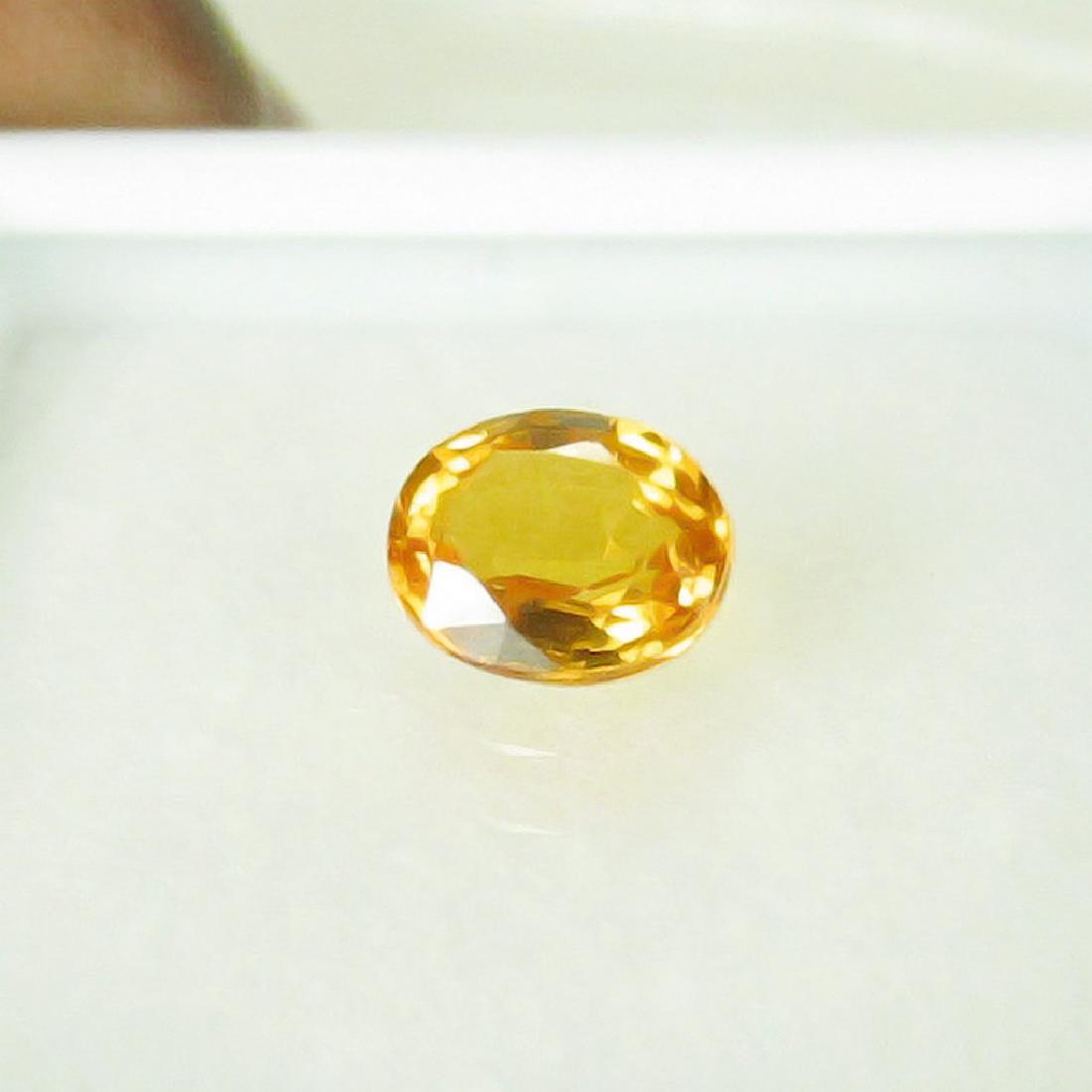 0.79 Carat Loose Sri Lanka Orange Sapphire Oval cut (1 of 2)