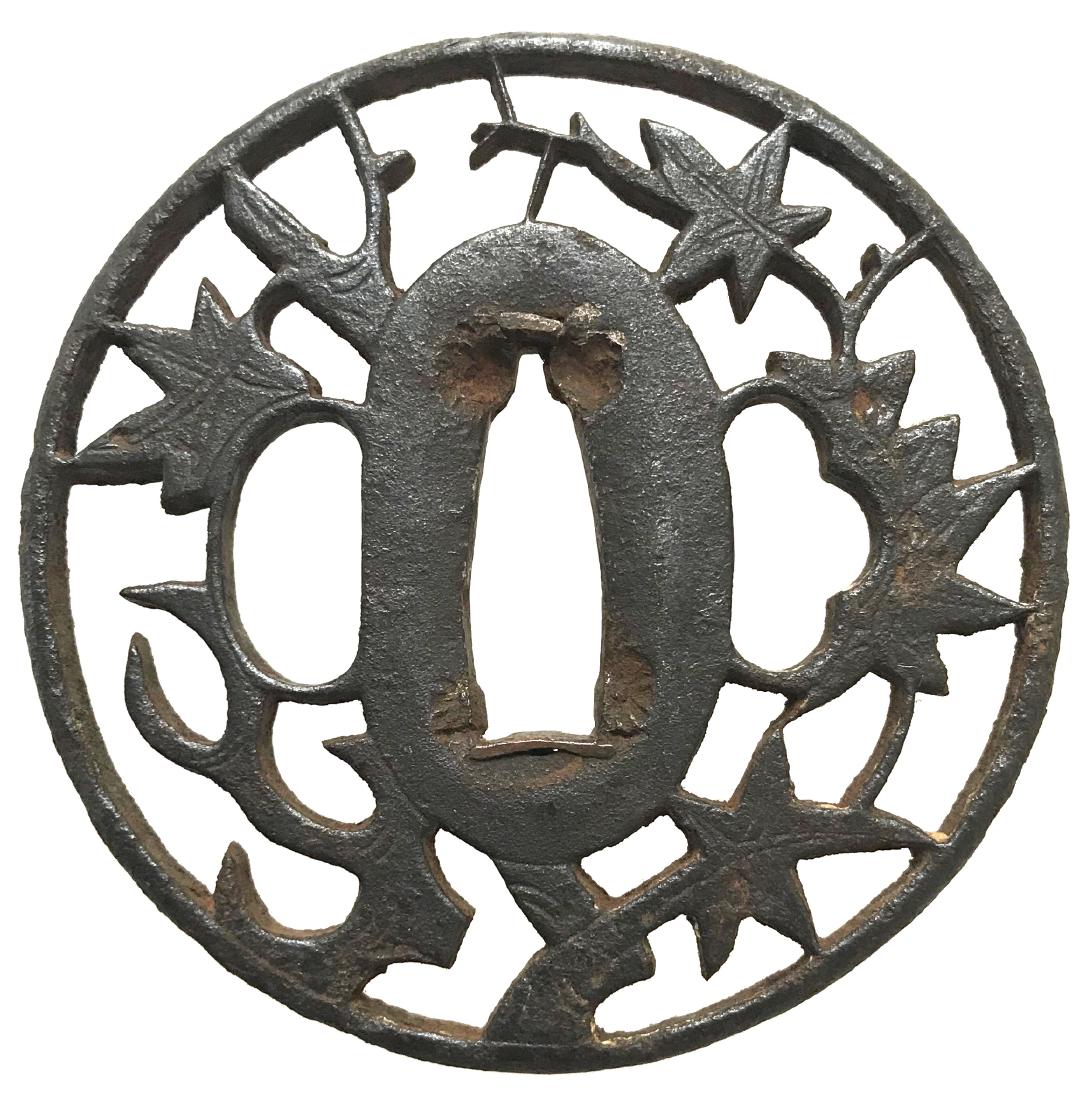 Sukashi tsuba with maple leaves motif: Title: Sukashi tsuba with maple leaves motif Origin: Japan Date: Edo Materials: Iron Dimensions: 69.0 x 69.1 x 4.4 mm Please note that this lot has a confidential reserve. When you leave a bid in adva