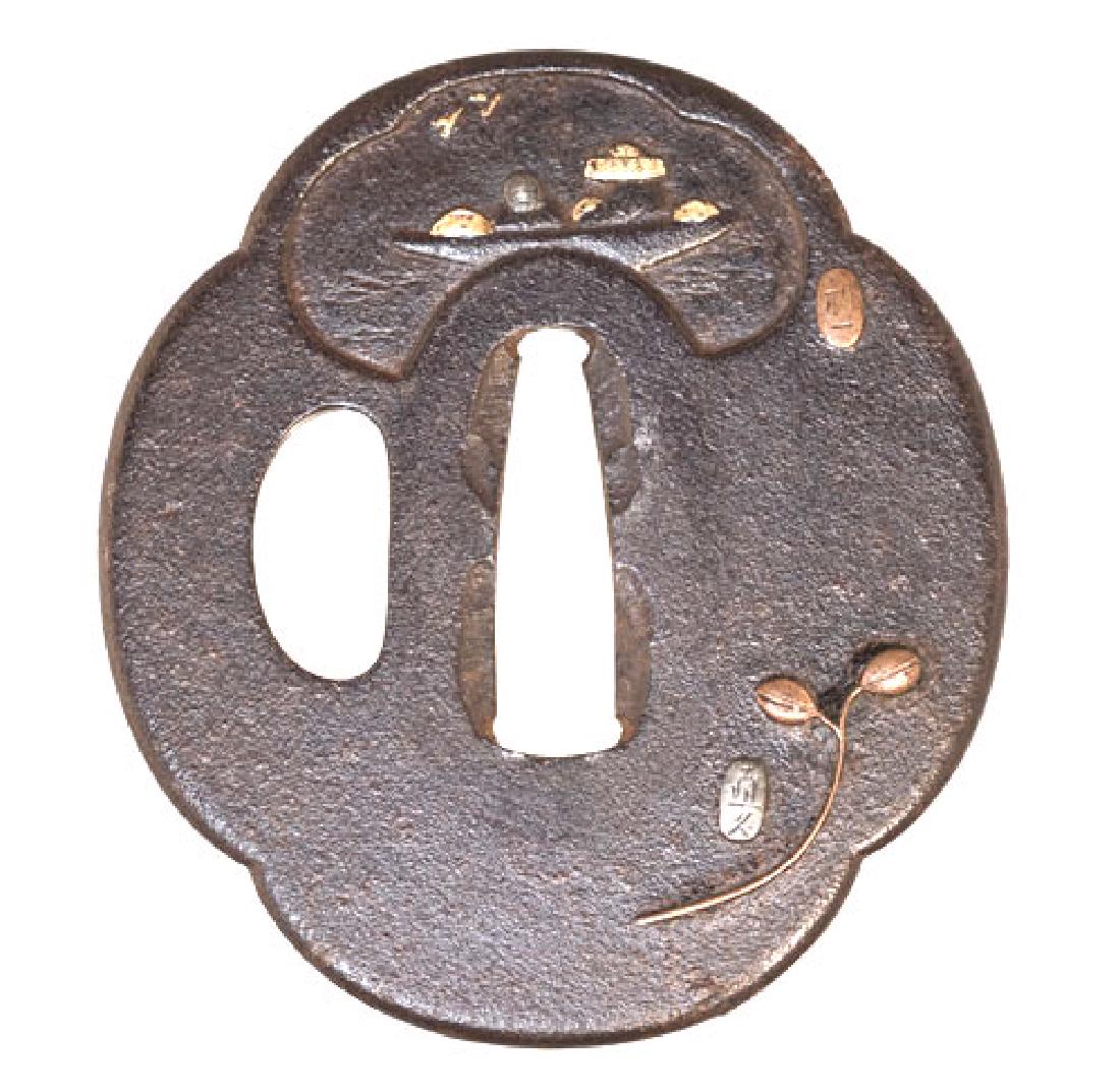 Iron tsuba with fan design carved and inlaid with gold. (1 of 2)