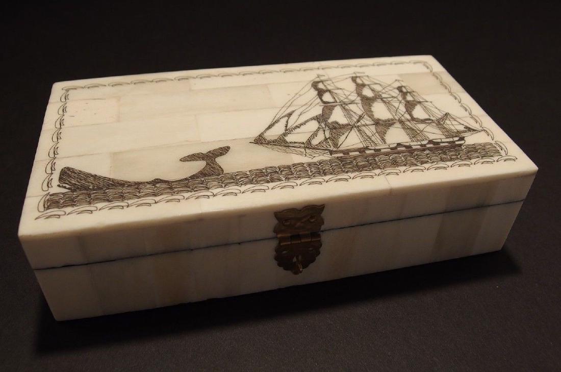 Folk Whale Chase Scrimshaw Bone & Wood Trinket Box: 6 3/8" Long x 3 7/8" Wide x 1 5/8" High Wonderful new reproduction scrimshaw carved ox bone box. As you can see this piece is tiled with bone on wood and decorated with a design typical of the period.