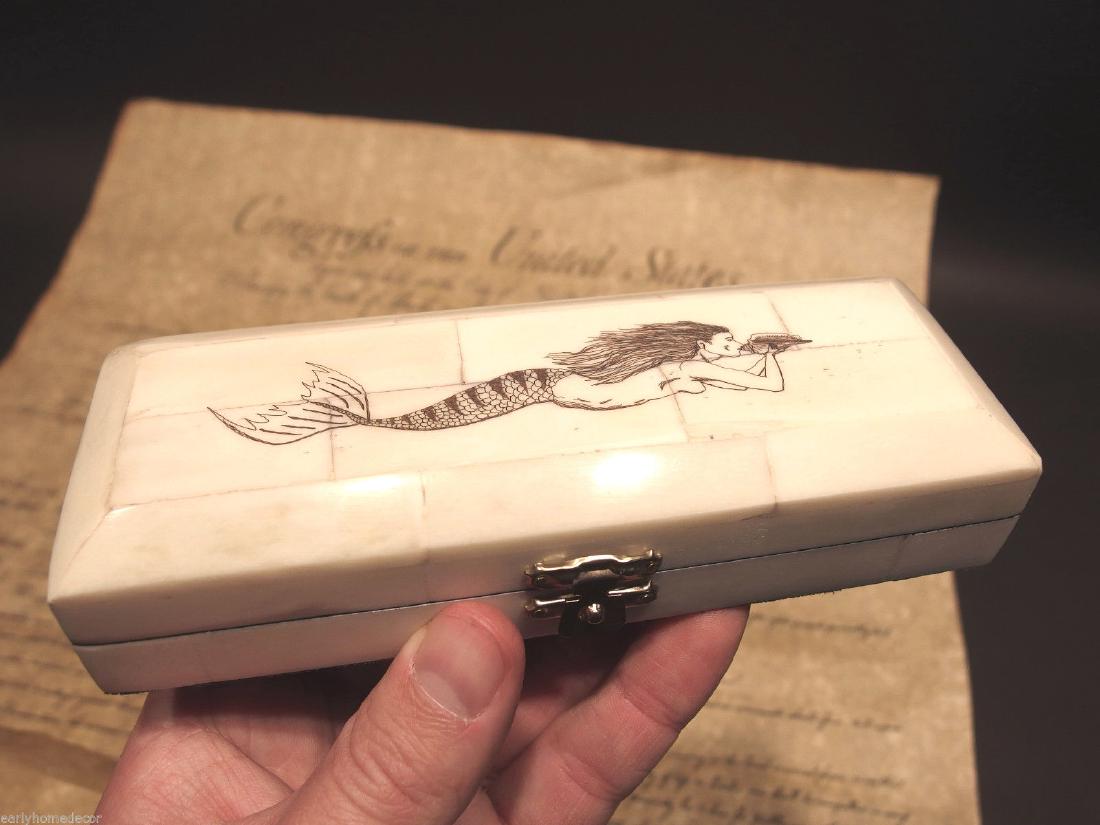 Mermaid Scrimshaw Etched Bone & Wood Trinket Stamp: Antique Style Folk Art Mermaid Scrimshaw Bone & Wood Trinket Stamp Jewelry Box Description 6 1/4" Long x 2 1/4" Wide x 1 3/8" High Wonderful new reproduction scrimshaw carved ox bone box. As you can s
