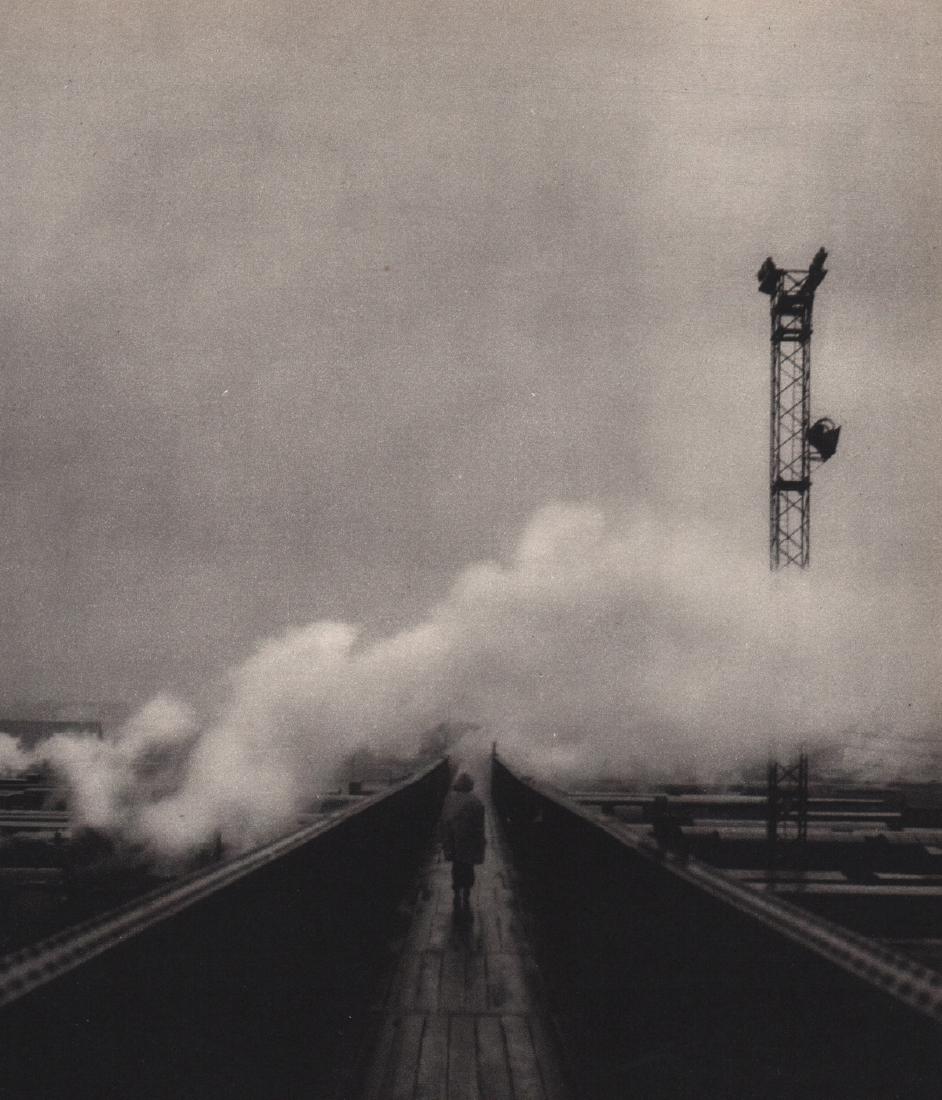 ROBERT DOISNEAU - Train Yard: Artist: ROBERT DOISNEAU Print Title: Train Yard Medium: Sheet-fed Gravure Printing Date: 1949 Printed in Switzerland Image Size: 6.5 x 8 inches Robert Doisneau (1912-1994) was a French photographer. I