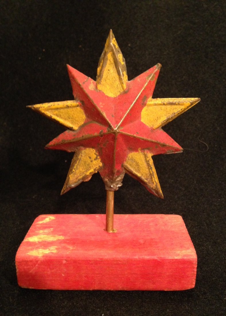 Painted 19th Century Star: 19th century tin star in original red and mustard paint. Nice surface and color. Base is custom. Good aged condition. (Don't know what it was originally used for-- maybe a lodge item). Star is 3 1/2" 