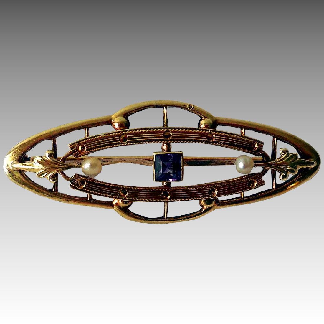 Edwardian 14K Gold, Amethyst & Seed Pearl Brooch: Title: Edwardian 14K Gold, Amethyst & Seed Pearl Brooch Maker: MAB Origin: Unknown Date/Period1900-1910 Materials: 14K Yellow Gold, Natural Amethyst, Seed Pearls Size: 1 3/8 Inches long This delicate 