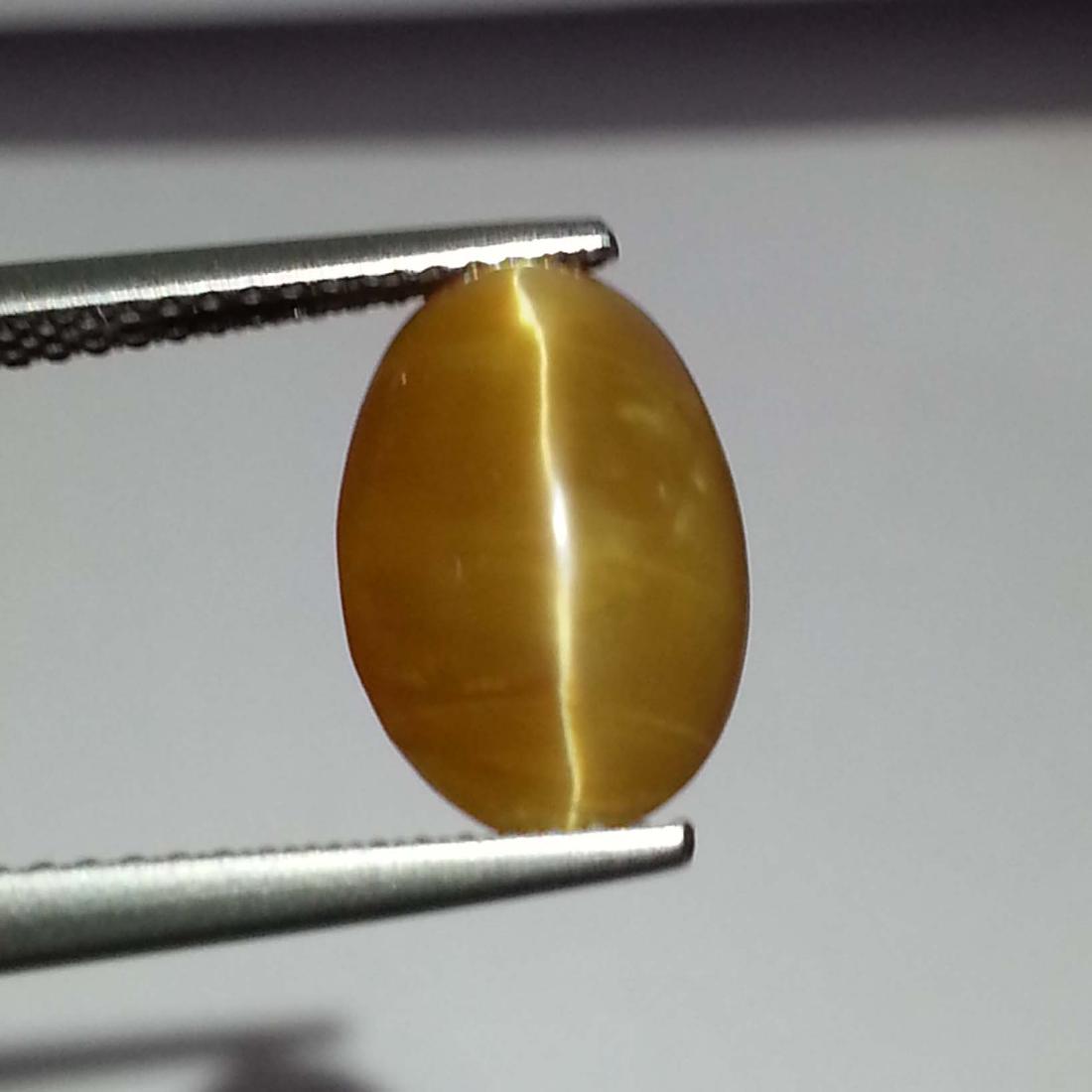 Honey Opal Cat's Eye - 3.88 Carat Loose: Item: Honey Opal Cat's Eye - 3.88 ct Loose gemstone Color/Clarity: VS Carat Weight: 3.88 Size (mm): 12.20 x 8.50 x 6.40 Oval - Ethiopia No Reserve: This lot starts at $1 and has no reserve as a courte
