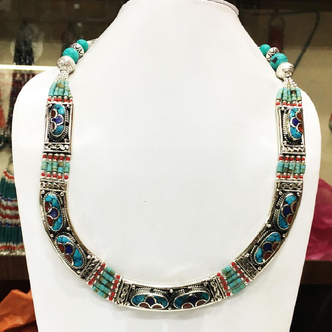 Tibetan Silver Turquoise Necklace: Item: Nepalese Handmade Turquoise Necklace Origin: Tibetan Handmade Metal Purity: Tibetan silver Gemstones: Turquoise & Coral Size (inches): 1-19 Please note that this lot has a confidential reserve. 