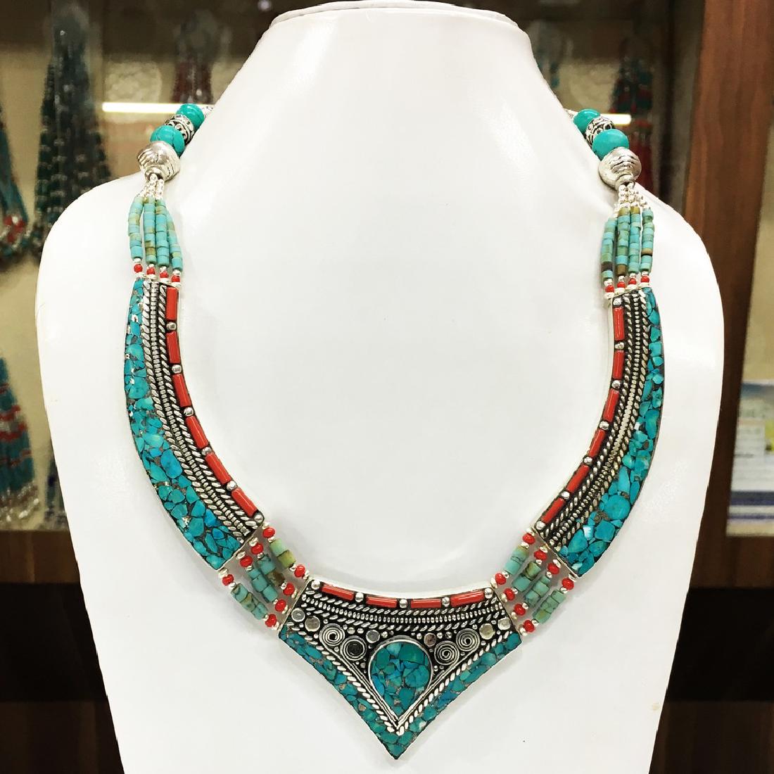 Buddhist Turquoise & Coral Necklace: Item: Buddhist Turquoise & Coral Necklace Origin: Tibetan Handmade Metal Purity: Tibetan silver Gemstones: Turquoise & Coral Size (inches): 20 Please note that this lot has a confidential reserve. Whe