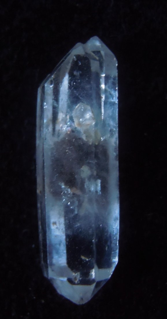 Quartz with inclusions. Biterminated and twinned: Item: Quartz with inclusions. Biterminated and twinned Origin: Mongolia, China Size: 2.5x0.5x0.5 clear, biterminated quartz with twinning at one end. Center has some inclusions, possibly carbon Please