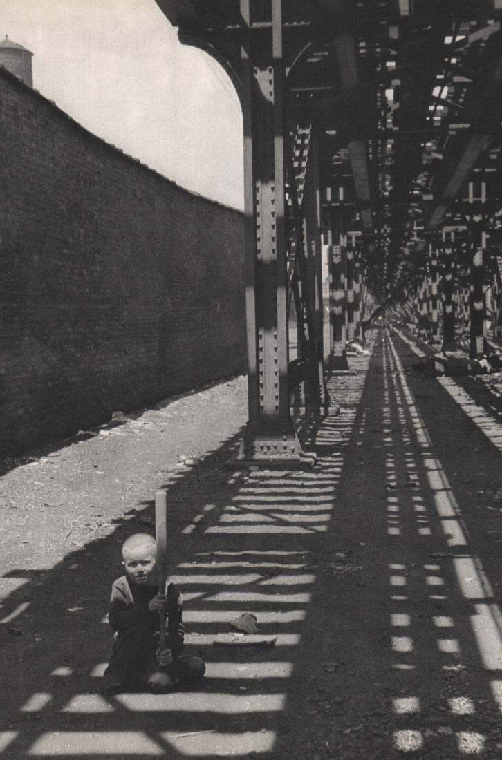HENRI CARTIER-BRESSON - Chicago, 1947: Artist: HENRI CARTIER-BRESSON Print Title: Chicago, 1947, Playing under the Elevated Train Medium: Sheet-fed Gravure Printing Date: 1952 Printed: France Image Size: 9 X 13 inches Henri Cartier-Bresson