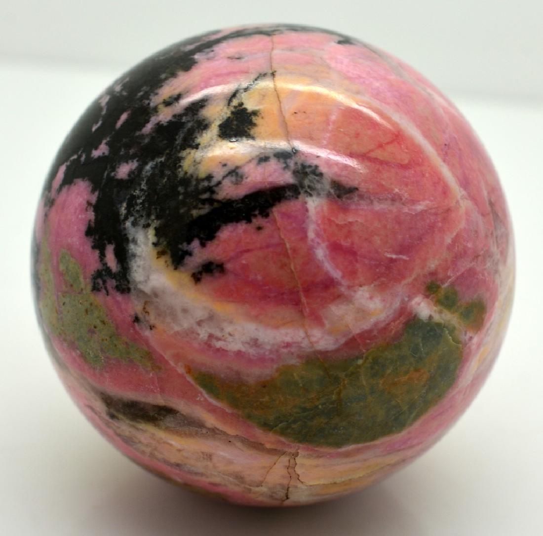Natural Rhodonite Round Sphere: Title: Natural Rhodonite Round Sphere Weight: 248 Grams Origin: Pakistan Materials: Ball Size: Round Size 170 mm Tratment: Natural No Reserve: This lot starts at $1 and has no reserve as a courtesy so