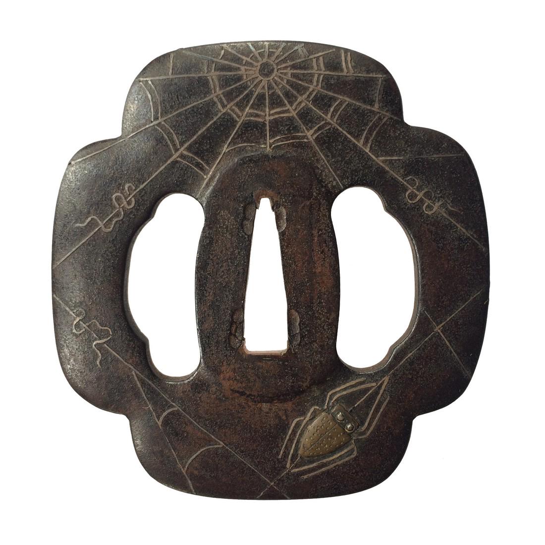 A Higo school iron tsuba with silver and brass inlay (1 of 3)