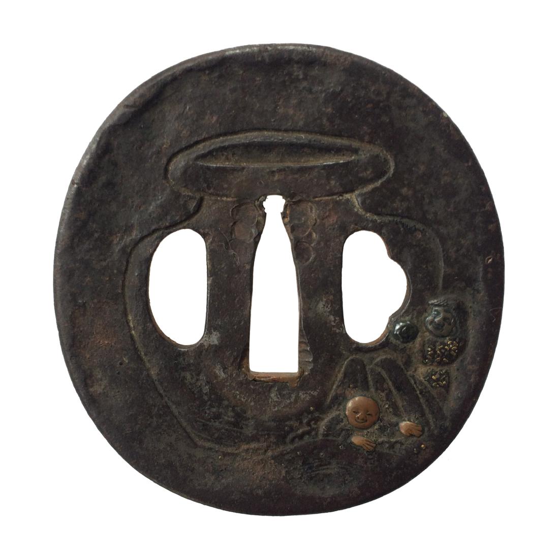 Signed iIron tsuba carved and inlaid with copper and (1 of 3)
