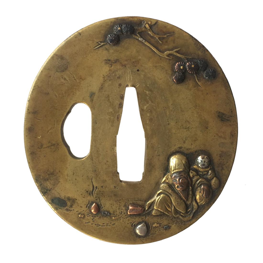 Kinko tsuba carved and ilaid with gold, copper, and (1 of 3)